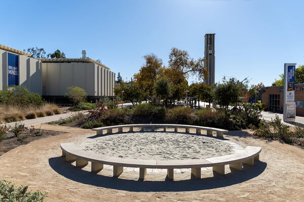 Circular seats at the Native Garden, with the Bell Tower in the distance