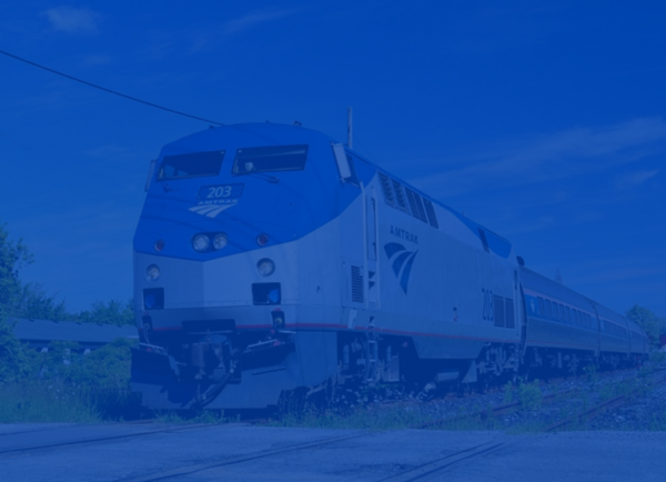 Ground view of an Amtrak train on the rails