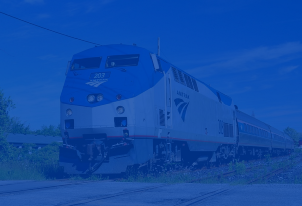Ground view of an Amtrak train on the rails