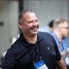 Attendee smiling at the welcome reception.