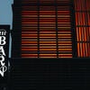 The Barn sign glowing at night.