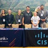 Sponsor representatives at their booth.