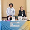 UC Tech News team at their booth.