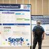 Attendees visiting the poster showcase.