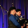 UC Riverside Pipe Band performing on stage.