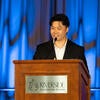 UC Tech Awardee speaking at the podium.
