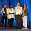 UC Tech Awardee smiling at the camera with UC CIOs.