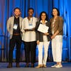 UC Tech Awardee smiling at the camera with UC CIOs.