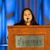 UC Tech Awardee speaking at the podium.