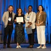 UC Tech Awardee smiling at the camera with UC CIOs.