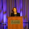 UC Tech Awardee speaking at the podium.
