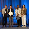 UC Tech Awardee smiling at the camera with UC CIOs.