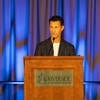 UC Tech Awardee speaking at the podium.
