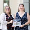UC Merced's representatives, Christy Snyder (L) and Rachel Bellofatto (R), holding the Buck.