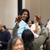 Attendee smiling after winning a raffle prize.